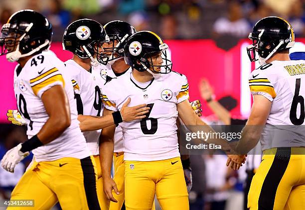 Kicker Shaun Suisham of the Pittsburgh Steelers celebrates a field goal in the third quarter against the New York Giants during a preseason game at...