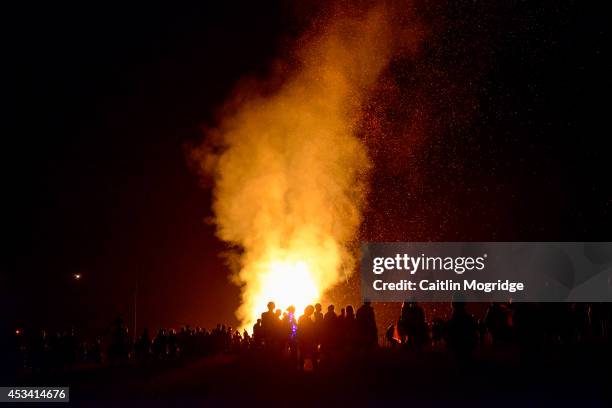 The fire procession on day 3 of Wilderness Festival at Cornbury Park on August 9, 2014 in Oxford, United Kingdom.