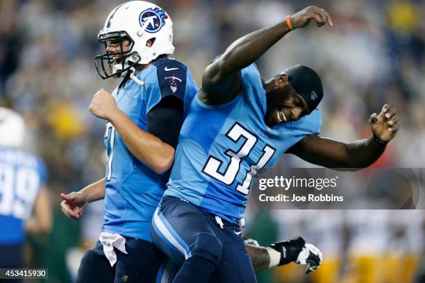 Bernard Pollard and Zach Mettenberger of the Tennessee Titans celebrate after a fourth quarter touchdown run by Jackie Battle during an NFL preseason...