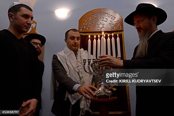 Russia's chief Rabbi Berel Lazar attends the festival of Hanukkah celebration at the notorious Butyrka remand prison in Moscow, on December 4, 2013....