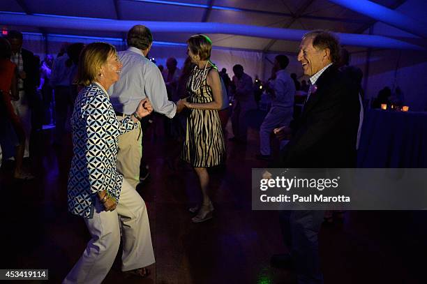 Guests dance at the post party at the Boston Pops On Nantucket Hosted By Real Simple and Coastal Living at Jetties Beach on August 9, 2014 in...