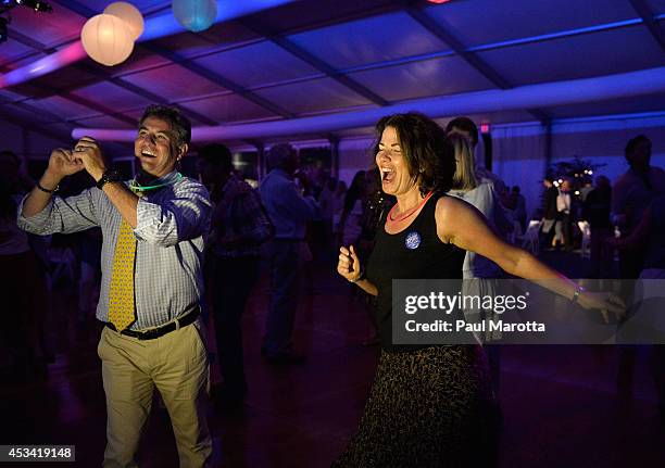 Guests dance at the post party at the Boston Pops On Nantucket Hosted By Real Simple and Coastal Living at Jetties Beach on August 9, 2014 in...