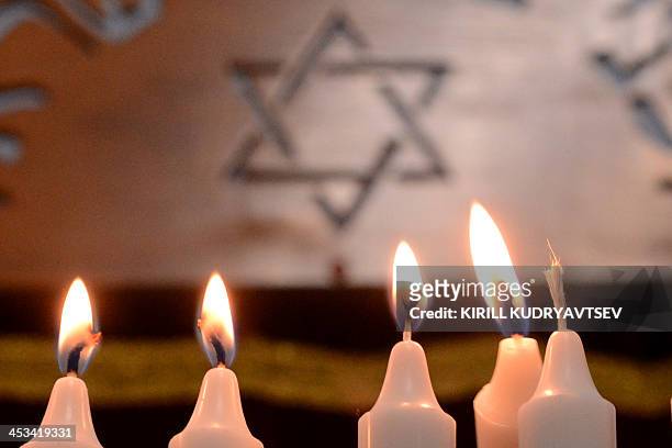 Candles stands in the notorious Butyrka remand prison in Moscow, on December 4 during the festival of Hanukkah celebration. AFP PHOTO / KIRILL...