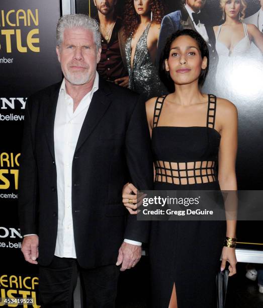 Actors Ron Perlman and daughter Blake Perlman arrive at the Los Angeles premiere of "American Hustle" at Directors Guild Theatre on December 3, 2013...