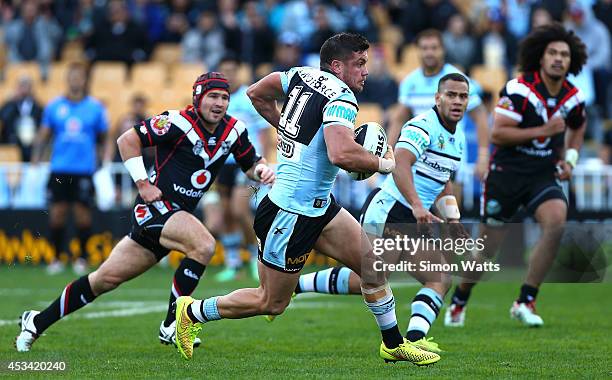 Chris Heighington of the Sharks makes a break during the round 22 NRL match between the New Zealand Warriors and the Cronulla Sharks at Mt Smart...