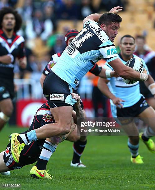 Chris Heighington of the Sharks looks to offload during the round 22 NRL match between the New Zealand Warriors and the Cronulla Sharks at Mt Smart...