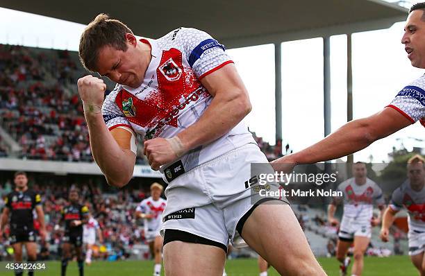 Brett Morris of the Dragons celebrates scoring a try during the round 22 NRL match between the St George Dragons and the Penrith Panthers at WIN...