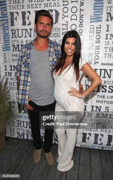 Personality Kourtney Kardashian and husband Scott Disick attend Women's Health Hosts Hamptons "Party Under The Stars" for RUN10 FEED10 at...