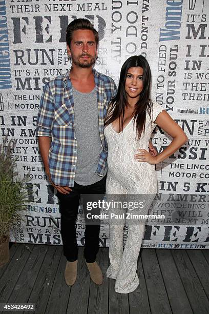 Personality Kourtney Kardashian and husband Scott Disick attend Women's Health Hosts Hamptons "Party Under The Stars" for RUN10 FEED10 at...