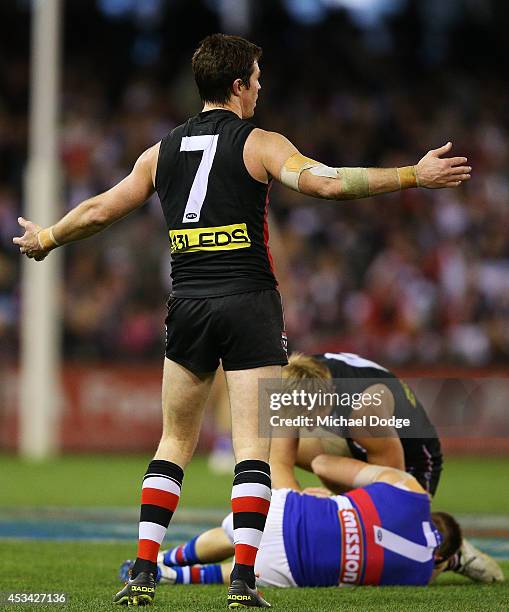 Lenny Hayes of the Saints gestures after tackling high Shaun Higgins of the Bulldogs to gives away a free kick during the round 20 AFL match between...