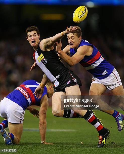 Lenny Hayes of the Saints is tackled by Sam Darley of the Bulldogs during the round 20 AFL match between the St Kilda Saints and the Western Bulldogs...