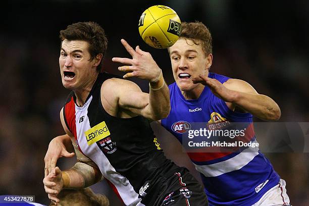 Lenny Hayes of the Saints is tackled by Sam Darley of the Bulldogs during the round 20 AFL match between the St Kilda Saints and the Western Bulldogs...