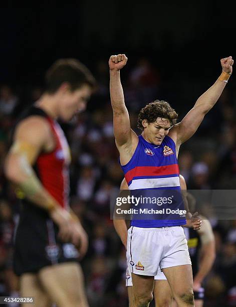 Will Minson of the Bulldogs celebrates victory on the siren next to Lenny Hayes of the Saints who played his last home game ever during the round 20...