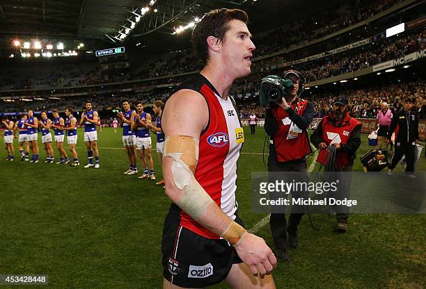 Lenny Hayes of the Saints walks off after his last home game as a guard of honour is provided by teamates and Bulldogs players during the round 20...