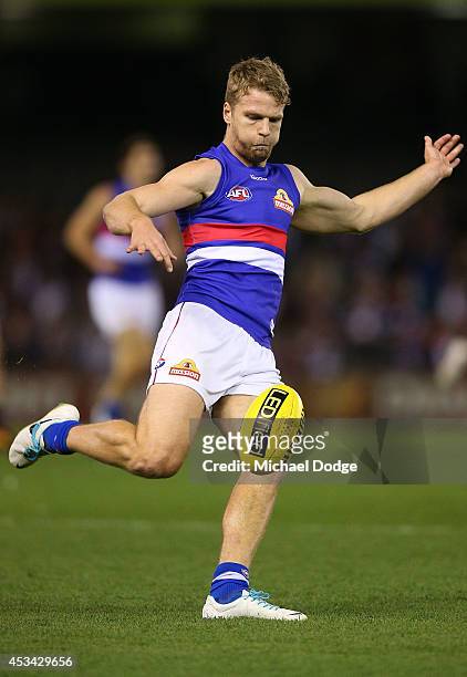 Jake Stringer of the Bulldogs kicks the ball during the round 20 AFL match between the St Kilda Saints and the Western Bulldogs at Etihad Stadium on...
