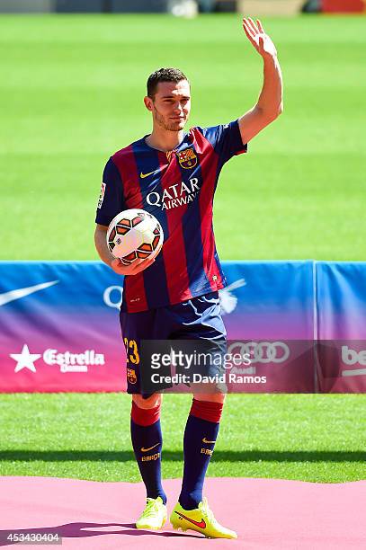 Thomas Vermaelen poses as he is unveiled as a new player for FC Barcelona at the Camp Nou stadium on August 10, 2014 in Barcelona, Spain.