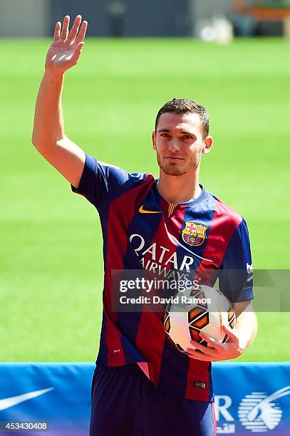 Thomas Vermaelen poses as he is unveiled as a new player for FC Barcelona at the Camp Nou stadium on August 10, 2014 in Barcelona, Spain.