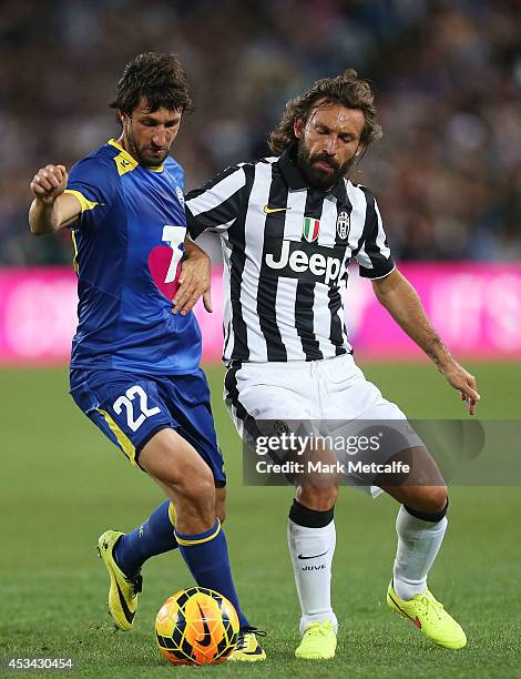 Thomas Broich of the All Stars and Andrea Pirlo of Juventus compete for the ball during the match between the A-League All Stars and Juventus at ANZ...