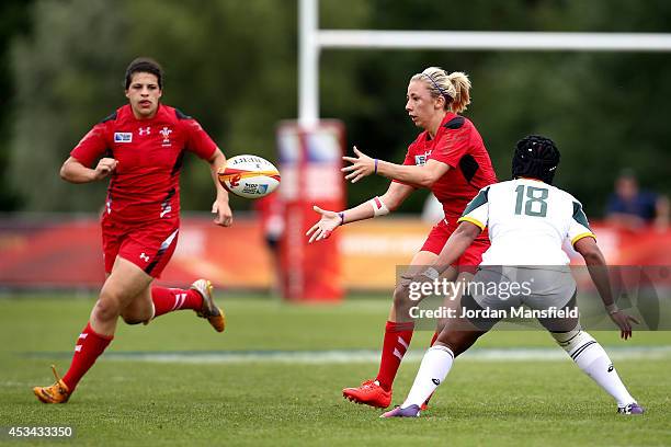 Elinor Snowsill of Wales passes to Rebecca De Filippo of Wales during the IRB Women's Rugby World Cup Pool C match between Wales and South Africa at...