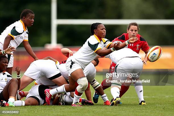 Fundiswa Plaatjie of South Africa passes the ball out during the IRB Women's Rugby World Cup Pool C match between Wales and South Africa at the...