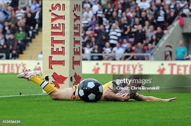 Liam Finn of Castleford Tigers goes over for a try during the Tetley's Challenge Cup Semi Final match between Widnes Vikings and Castleford Tigers at...