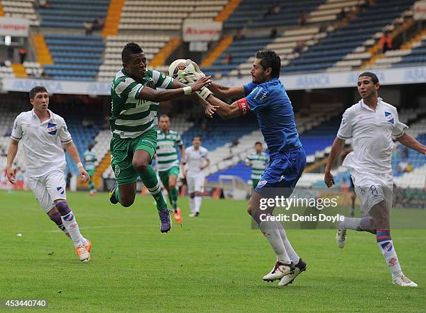 Heldon Ramos of Sporting Clube de Portugal in action against Gustavo Munua of Club Nacional de Football during the Teresa Herrera Trophy match...