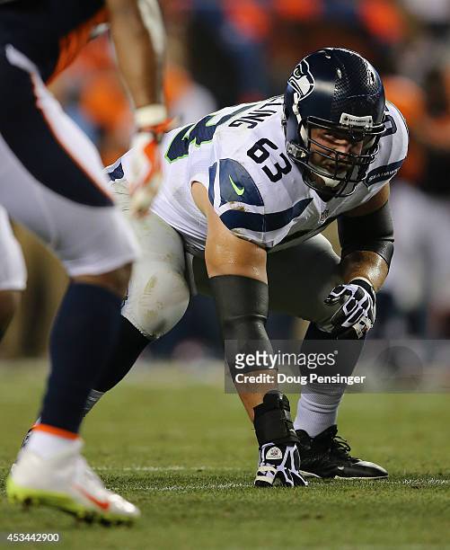 Guard Stephen Schilling of the Seattle Seahawks lines up against the Denver Broncos during preseason action at Sports Authority Field at Mile High on...