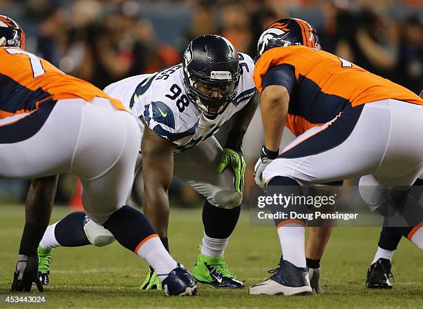 Defensive end Greg Scruggs of the Seattle Seahawks lines up against the Denver Broncos during preseason action at Sports Authority Field at Mile High...