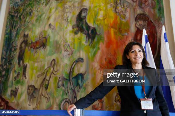 Anne Hidalgo, Paris deputy mayor and Socialist Party candidate for the primary round of Paris municipal elections stands next to a tapestry made by...