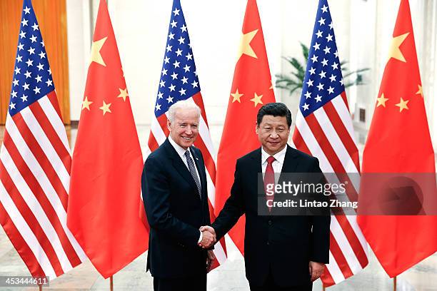 Chinese President Xi Jinping shake hands with U.S Vice President Joe Biden inside the Great Hall of the People on December 4, 2013 in Beijing, China....