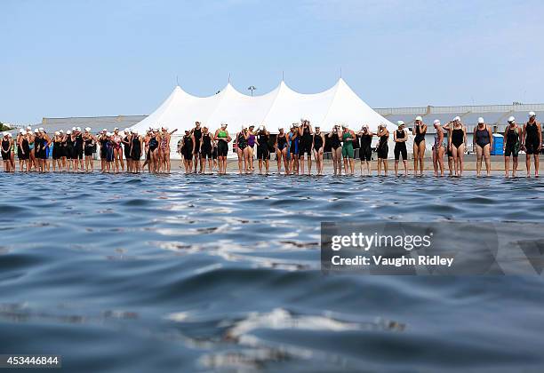 Swimmers prepare for the start of the Women's 45-49 Age Group 3km swim during the 15th FINA World Masters Championships at Parc Jean-Drapeau on...