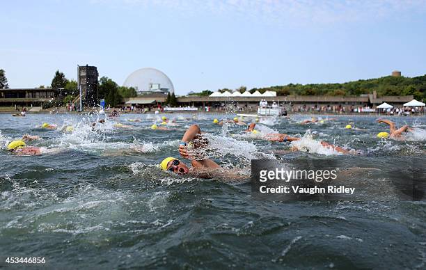 Bruno Fabregoule of France competes in the Men's 50-54 Age Group 3km swim during the 15th FINA World Masters Championships at Parc Jean-Drapeau on...