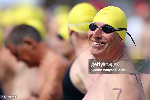 Luc Coelembier of France competes in the Men's 50-54 Age Group 3km swim during the 15th FINA World Masters Championships at Parc Jean-Drapeau on...