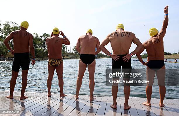 Swimmers prepare for the Men's 45-49 Age Group 3km swim during the 15th FINA World Masters Championships at Parc Jean-Drapeau on August 10, 2014 in...
