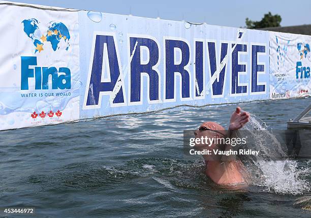 John Micks of Canada competes in the Men's 50-54 Age Group 3km swim during the 15th FINA World Masters Championships at Parc Jean-Drapeau on August...