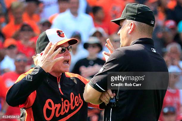 Manager Buck Showalter of the Baltimore Orioles argues with second base umpire Jeff Nelson after being ejected during the sixth inning against the...