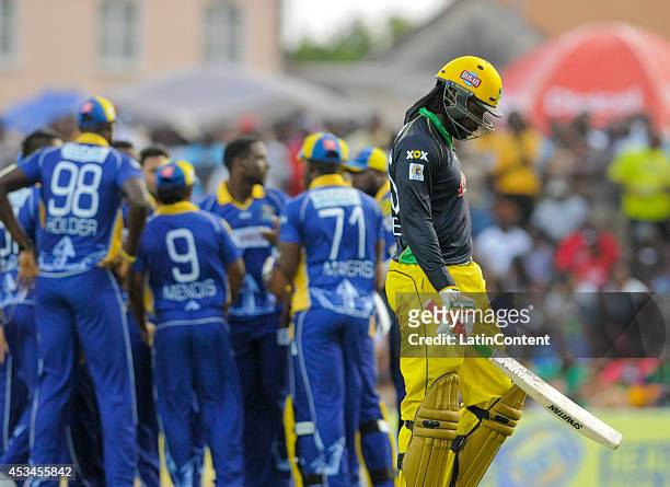 Chris Gayle of Jamaica Tallawahs walkes back to the dressing room lbw by Ravi Rampaul of Barbados Tridents during a match between Barbados Tridents...