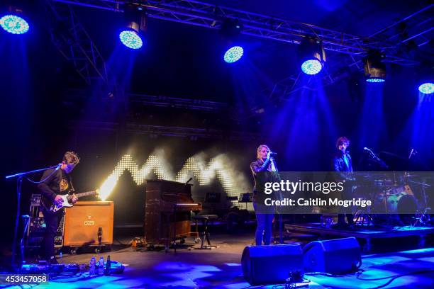 Dot Major and Hannah Reid of London Grammar perform on stage at Wilderness Festival at Cornbury Park on August 10, 2014 in Oxford, United Kingdom.