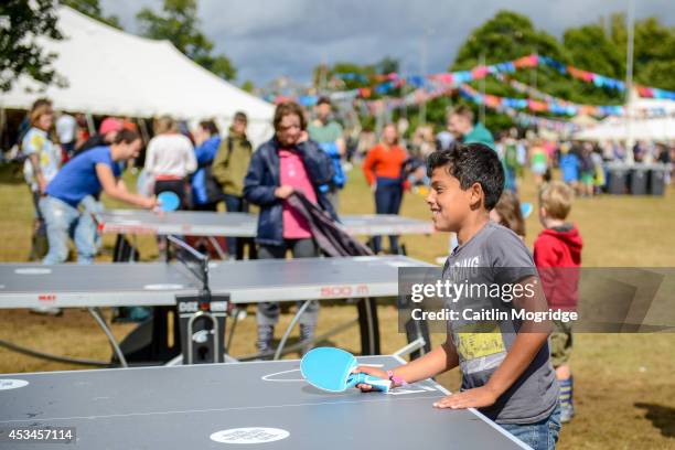 Children enjoy the on site activities at Wilderness Festival at Cornbury Park on August 10, 2014 in Oxford, United Kingdom.