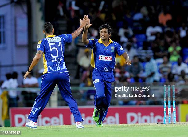 Jeevan Mendis of Barbados Tridents celebrates the dismissal of Adam Voges of Jamaica Tallawahs during a match between Barbados Tridents and Jamaica...