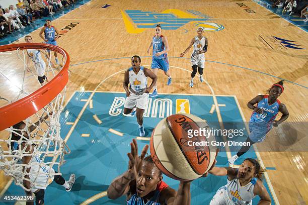 Sancho Lyttle of the Atlanta Dream shoots the ball past Courtney Clements of the Chicago Sky on August 10, 2014 at the Allstate Arena in Rosemont,...