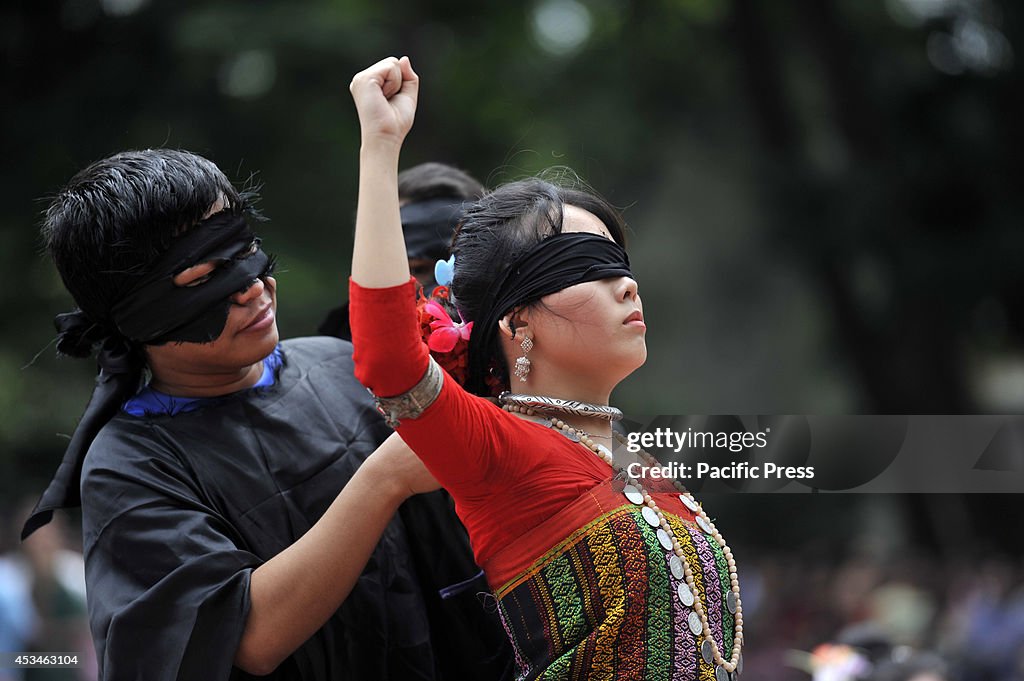 The indigenous girls perform a dance at Shahid Minar in...