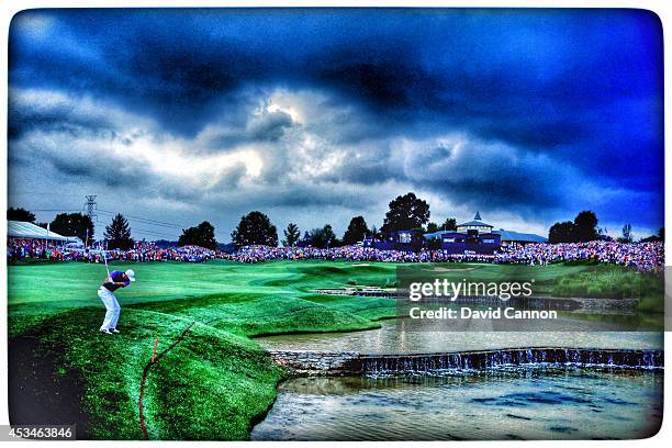 Rory McIlroy of Northern Ireland hits his second shot on the 18th hole during the final round of the 96th PGA Championship at Valhalla Golf Club on...