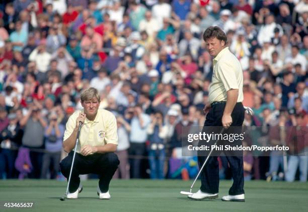 Peter Baker and Ian Woosnam of the European team lining up a putt during the Ryder Cup golf competition held at The Belfry, Warwickshire, 24th...