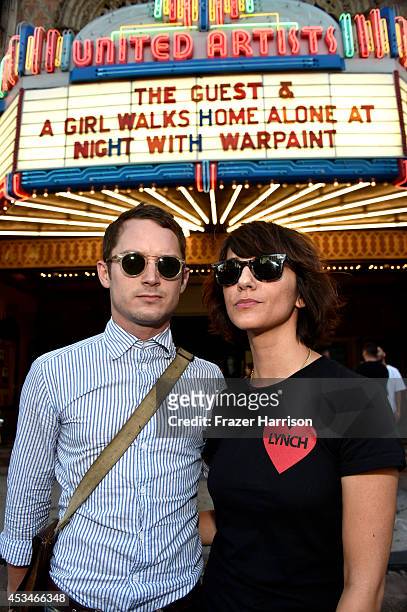 Producer Elijah Wood and director Ana Lily Amirpour attend the screening of "A Girl Walks Home Alone at Night" with Warpaint in concert during...