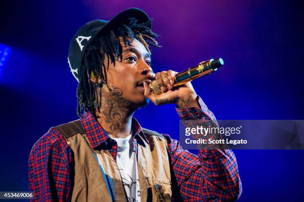 Wiz Khalifa performs during the Under the Influence of Music Tour at DTE Energy Music Theater on August 10, 2014 in Clarkston, Michigan.