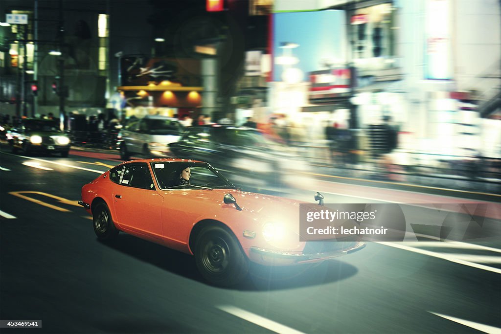 Tokyo nightrace in einem oldtimer sportscar