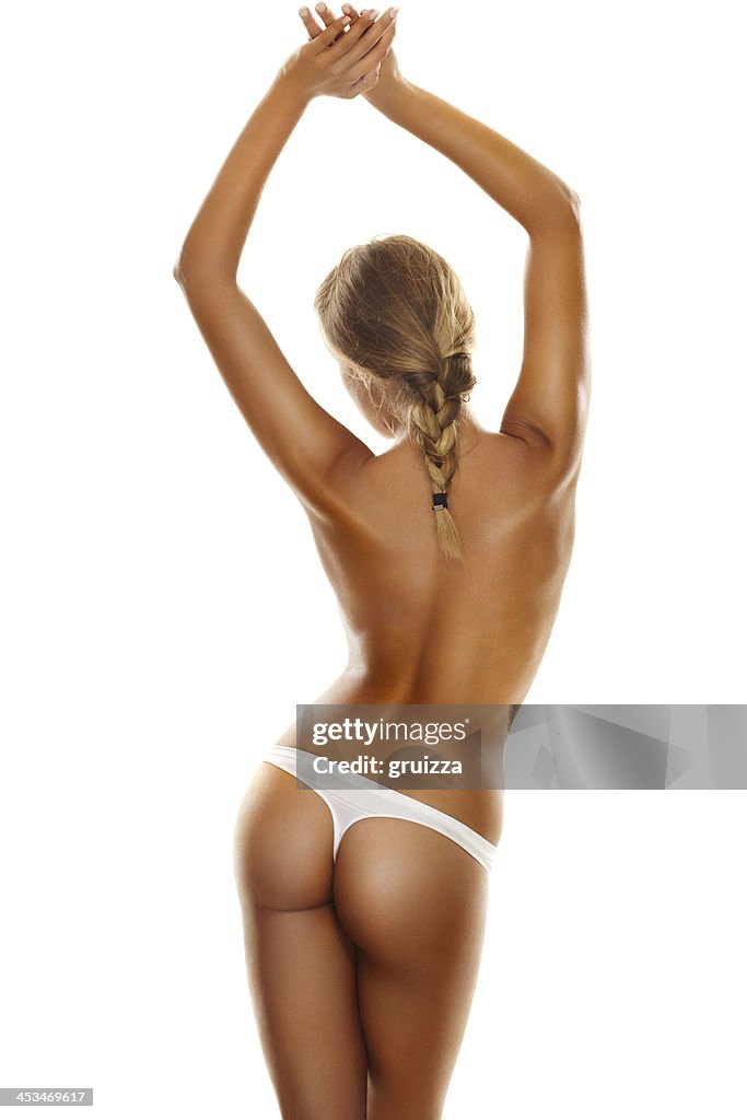 Back side view of a young, blonde woman's perfect body