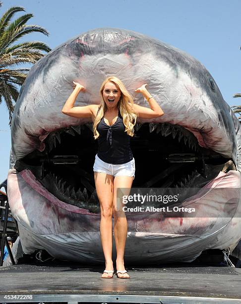 Actress Alana Curry poses with Sharkzilla at the Discovery Channel's Day 2 of Shark Week Kickoff with FinFest 2014 hosted by The Discovery Channel...