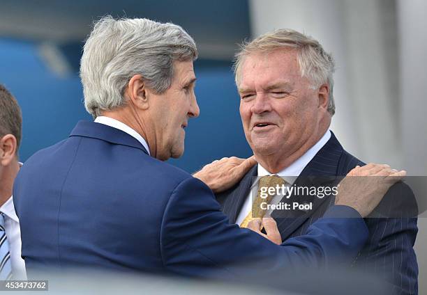 Secretary of State John Kerry is greeted by the Australian Ambassador to the US Kim Beazley on his arrival on August 11, 2014 in Sydney, Australia....